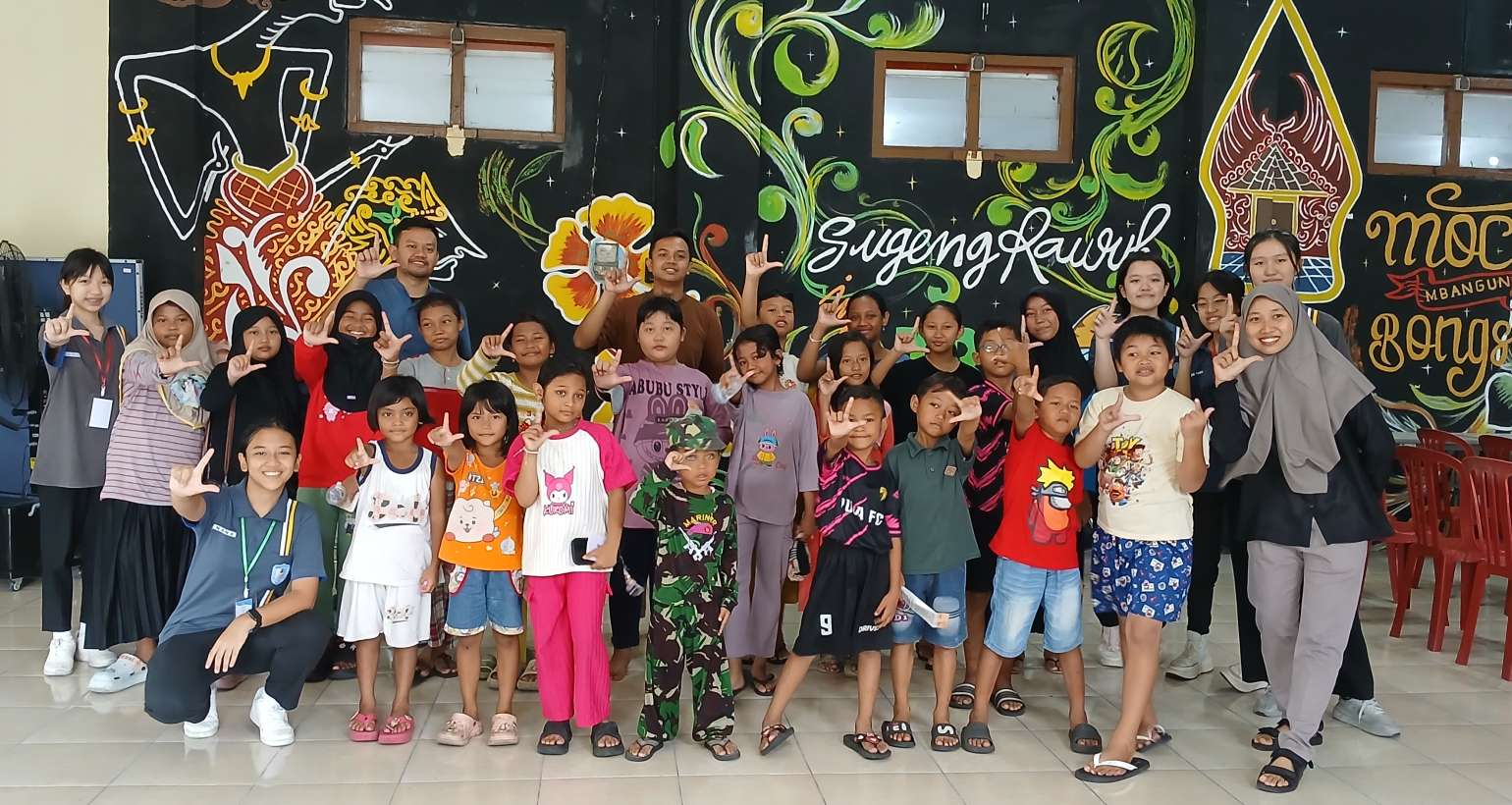 KEGIATAN MENDONGENG BERSAMA PUSTAKAWAN JUNIOR DI TAMAN BACA MASYARAKAT (TBM) BALAI RW 2 KERTAJAYA